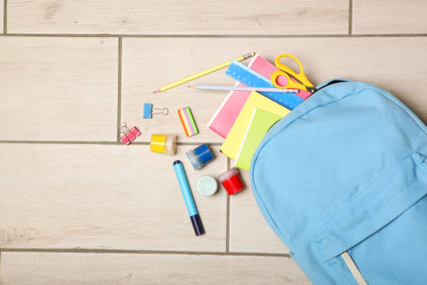 istock school backpack and school stationery top view. Concept back to school. 1257565231