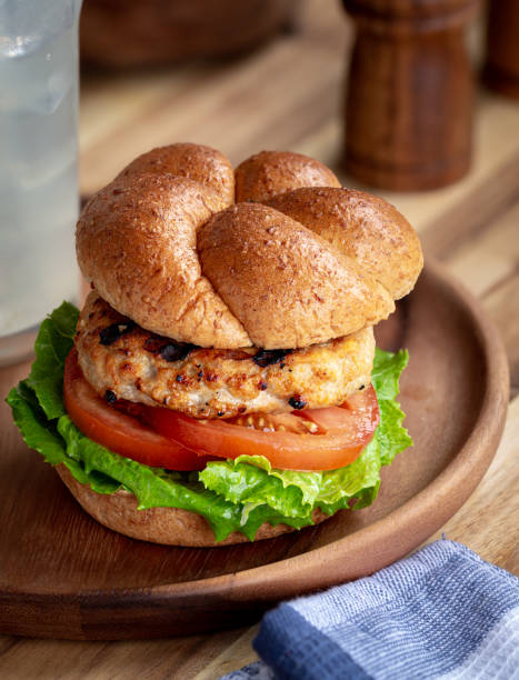 grilled turkey burger on a bun - turkey burger imagens e fotografias de stock