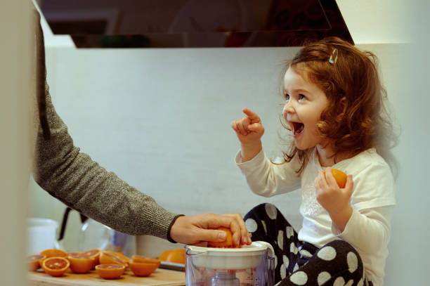 istock Excited baby girl loving grapefruit 1257567997