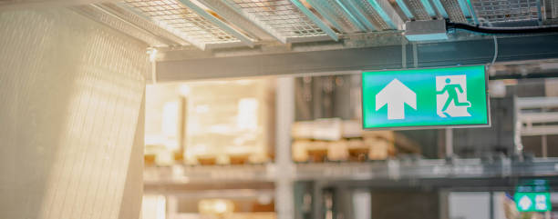 istock Emergency fire exit sign show the way to escape at the public area 1257568055