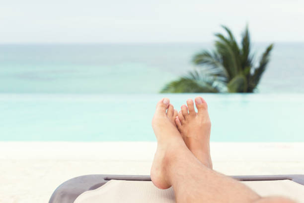 istock Tourist relaxing on swimpool at summer vacations 1257568729