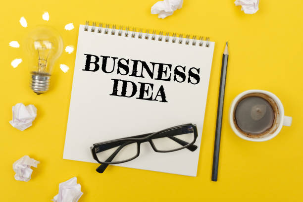 istock Businessman presses button on the interactive screen with the inscription - BUSINESS IDEA 1257569471