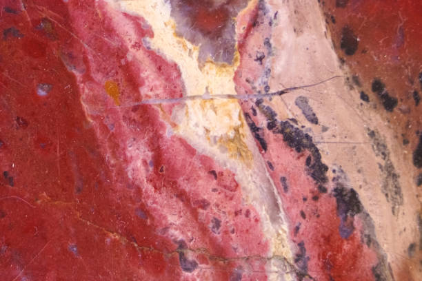 istock Texture of polished red stone with milky spots 1257569512