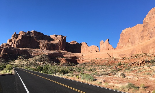 The iconic view along US Highway 163 in Utah leading south toward the buttes of Monument Valley, Arizona.