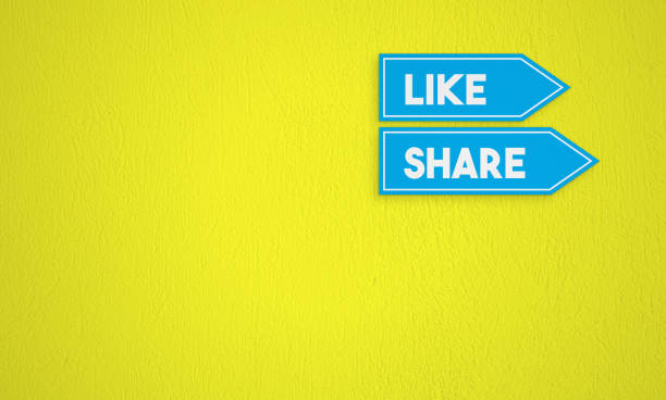 istock Like and Share Directional Sign On The Yellow Wall Background 1257572665