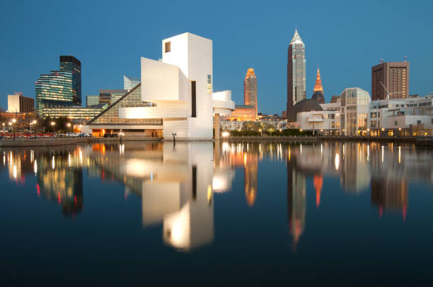 Skyline of Cleveland at night. Cleveland, Ohio, United States - July 08, 2018: City skyline at dusk from the harbor. great lakes photos stock pictures, royalty-free photos & images
