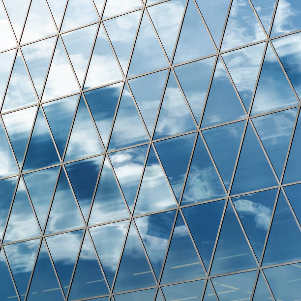 istock The sky is reflected in the triangular windows of the modern building. 1257574208