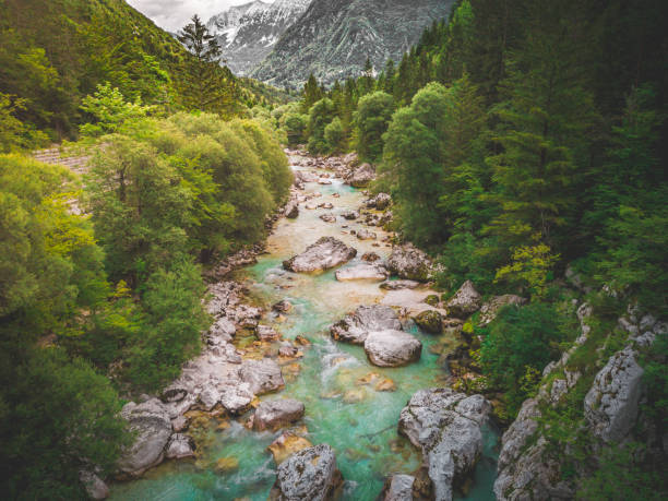 istock Aerial Crystal Clear Light Blue Mountain River in Soca Valley with fast rapids 1257575780