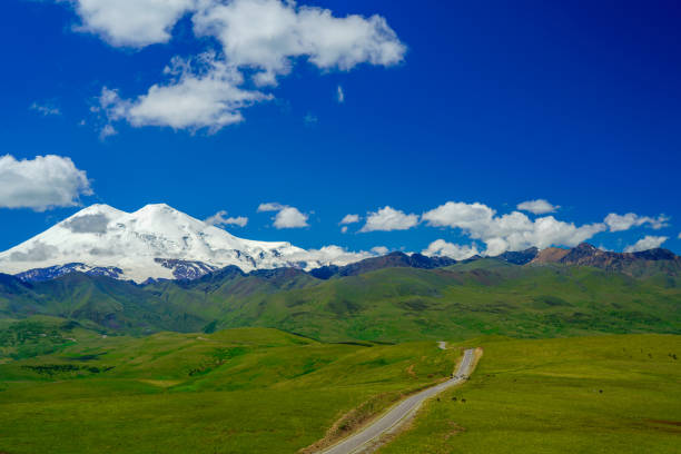 istock Road Leading To Mount Elbrus In Summer beautiful blue Sky 1257578197
