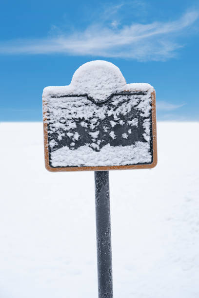 Frozen sign covered in snow and ice crystals