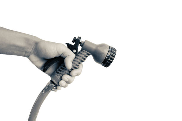 hand of man is hold Water sprayer for vegetable watering isolated on white background