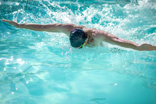 istock Professional male swimmer having a workout in pool 1257582022