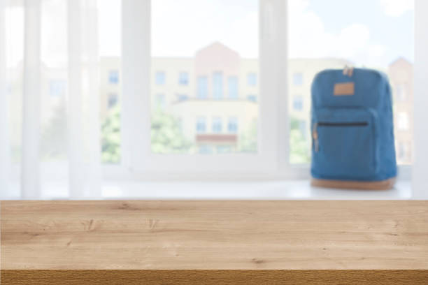 istock Look out of window at blurred school building from table 1257582150