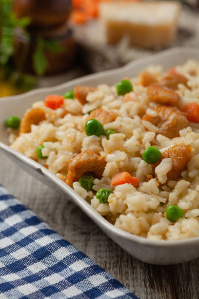 istock Delicious risotto with chicken and green peas. 1257582871