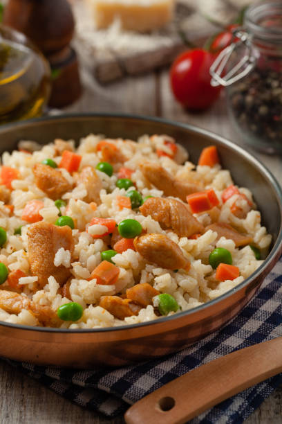 istock Delicious risotto with chicken and green peas. 1257583004