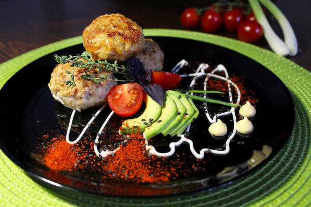 istock Fried cutlets are decorated with mayonnaise with herbs and cherry tomatoes 1257583190