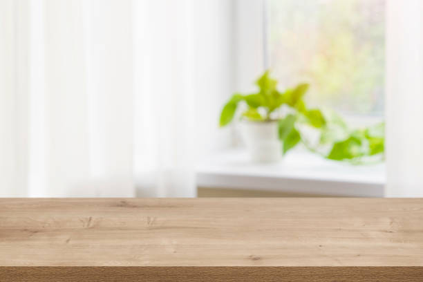 istock Wood texture table on defocused summer window sill background 1257583827