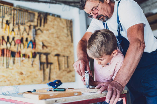 istock Grandfather and his grandson repairing staff in garage 1257584708