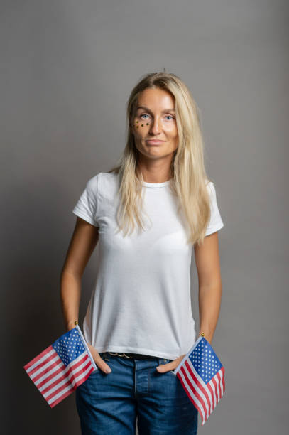 istock woman with american flag 1257591781