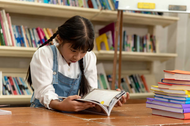istock Education image,asian children happy learning in library at school. 1257593211