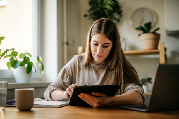 istock Young girl working from home 1257593704