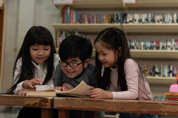 istock Education image,asian children happy learning in library at school. 1257595157