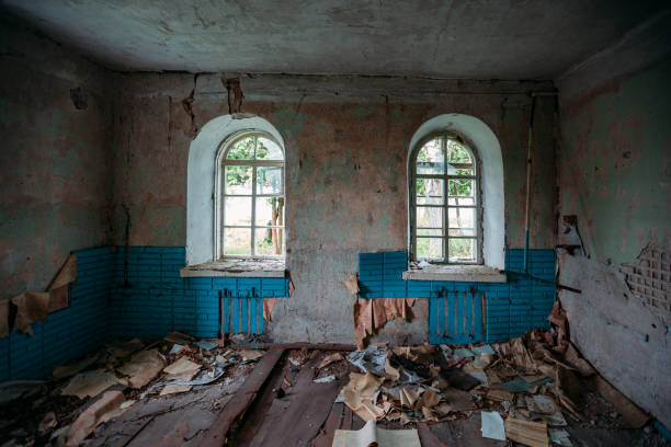 istock Interior of messy dirty room at old abandoned building 1257596342