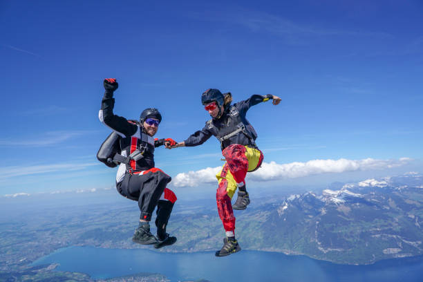 istock Freefall flier descend through lofty skies above mountain landscape 1257601005