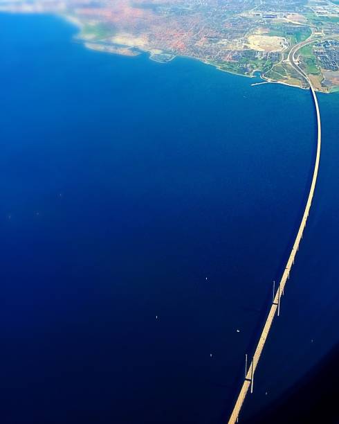 Arial shot of The Bridge between Sweden and Denmark, famous from the series The Bridge. The Øresund Bridge is an approximately 16 km long road and rail link between Sweden and Denmark. It consists of three sections: a bridge, an artificial island and a tunnel.