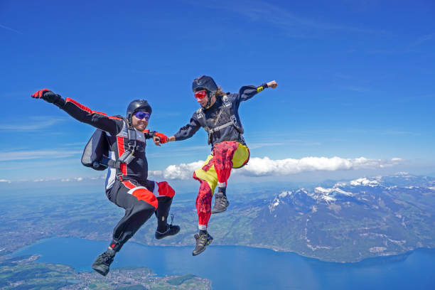 istock Freefall flier descend through lofty skies above mountain landscape 1257601251