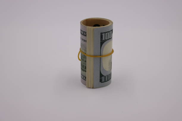 istock Money. Roll of dollars on white background 1257602046