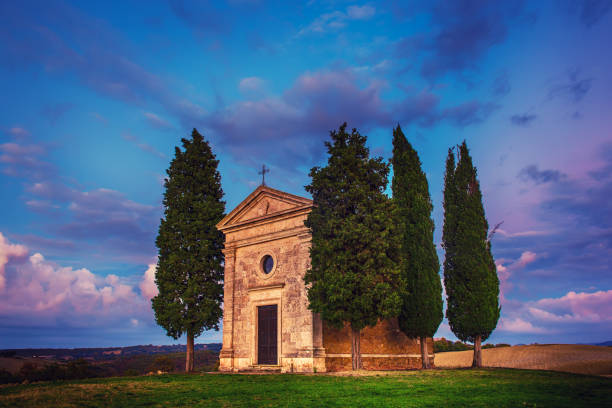 Popular photography and touristic location in Tuscany, amazing Vitaleta chapel at colorful sunset, Pienza, Tuscany, Italy, Europe. Travel background