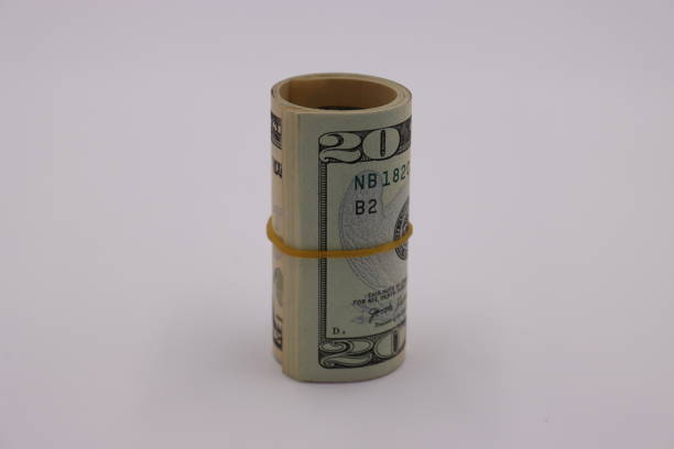 istock Money. Roll of dollars on white background 1257602269