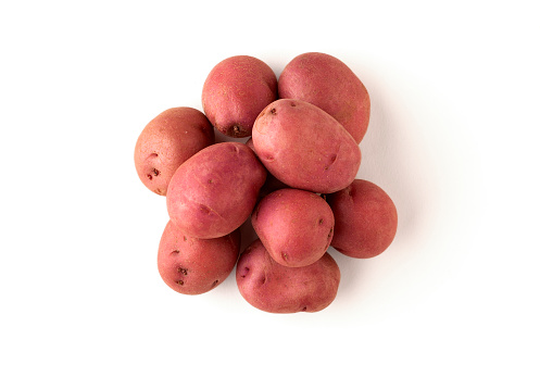 Organic small red potatoes isolated on white background.