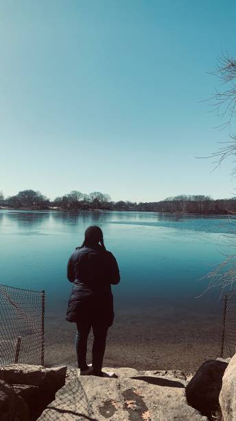 istock Lady at a lake 1257603650