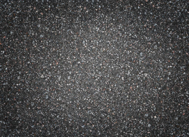 istock Asphalt road texture, top view. Dark grey abstract background. 1257603940