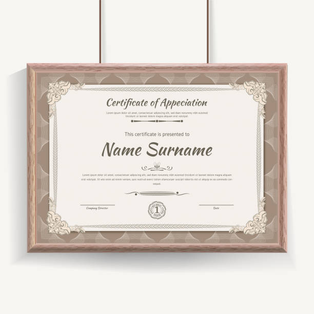 istock Official beige guilloche border for certificate. Vector illustration. Certificate in beige wooden frame hanging on wall 1257604269