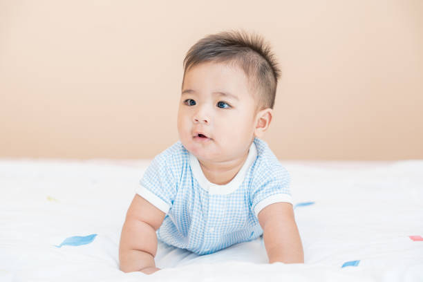 istock A cute baby boy is crawling. 1257604318