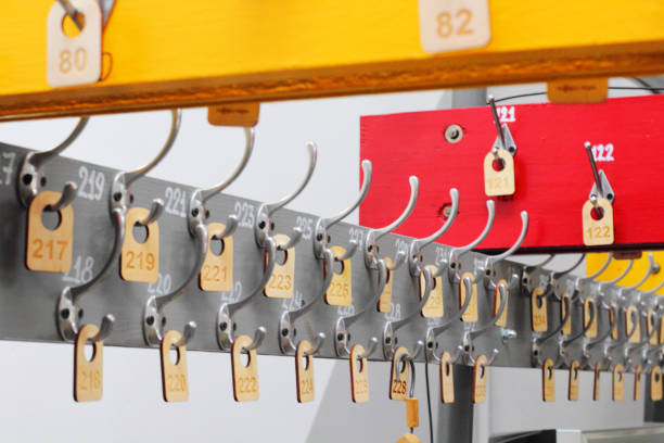 istock Empty hangers in a school wardrobe waiting for students. School or education theme concept. 1257604360