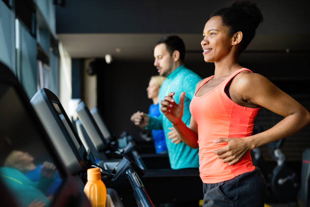 istock People running on treadmill in gym doing cardio workout 1257605944