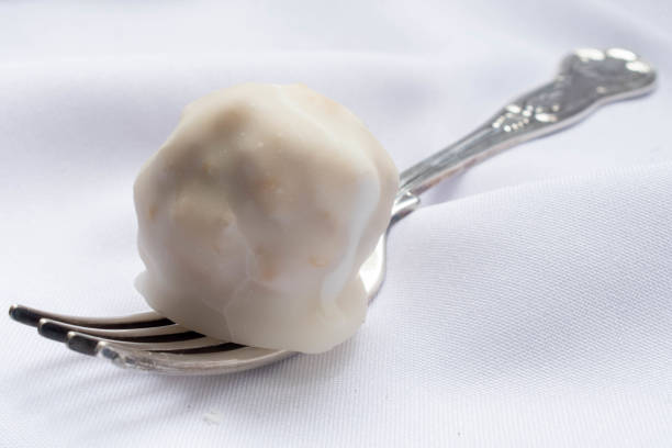 istock candied walnuts in glace sugar on fork with white background 1257606523