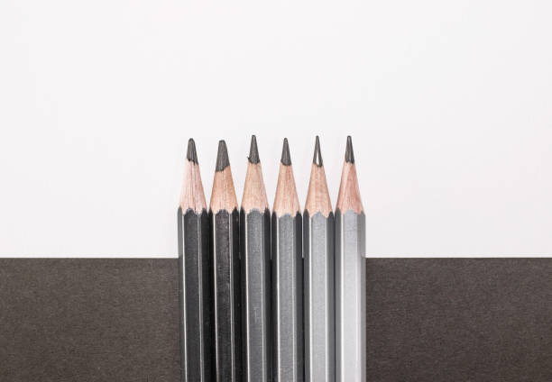 Close-up shot of Graphite wooden pencil on an isolated white background