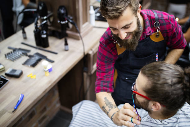 istock Client during beard and moustache grooming in barber shop 1257607698