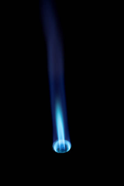 istock Gas burner with blue fire flame at black background 1257610245