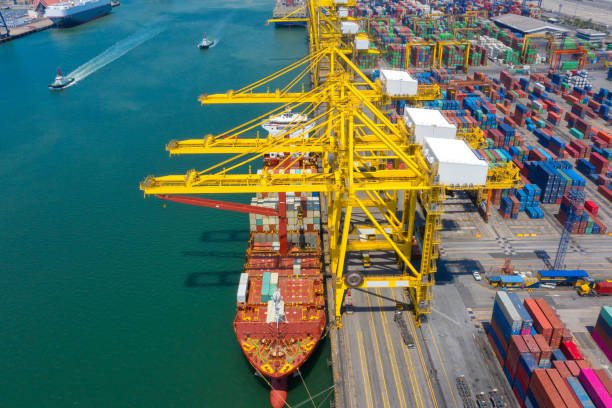 istock Container , container ship in export and import business and logistics. Shipping cargo to harbor by crane. Water transport International. Aerial view and top view. 1257611216