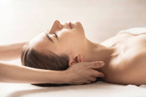 istock Young woman having her head massaged 1257611496
