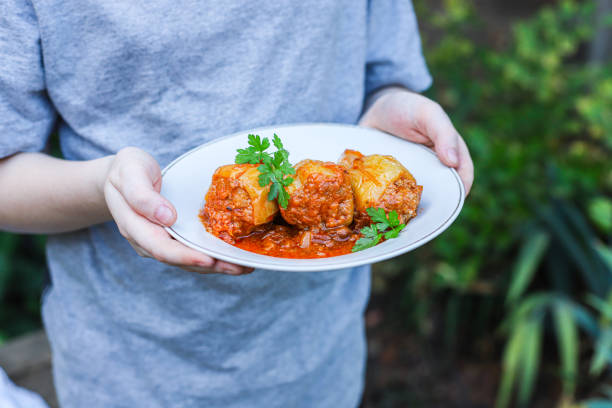 pepper stuffed meat stuffing and vegetables tomato sauce second course food background copy space
