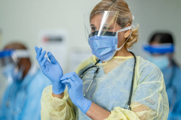 istock West Indian Doctor wearing full PPE, personal protective equiptment 1257612654