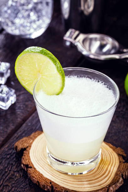istock Pisco sour, a typical drink from Peru and Chile, prepared based on pisco and lemon, sweetened with cognac, eggs, served cold. 1257612739