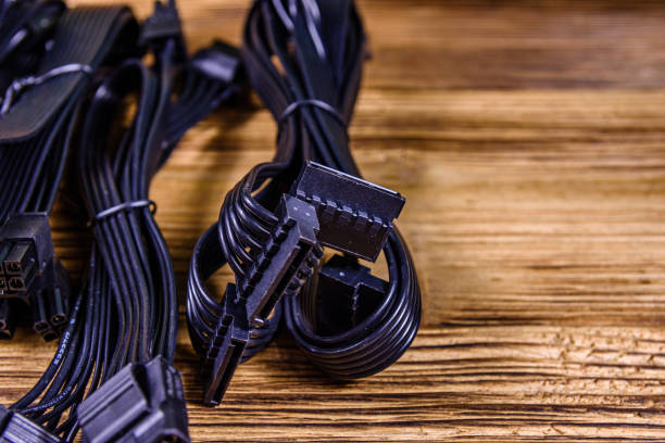 Set of computer psu cables on a wooden background